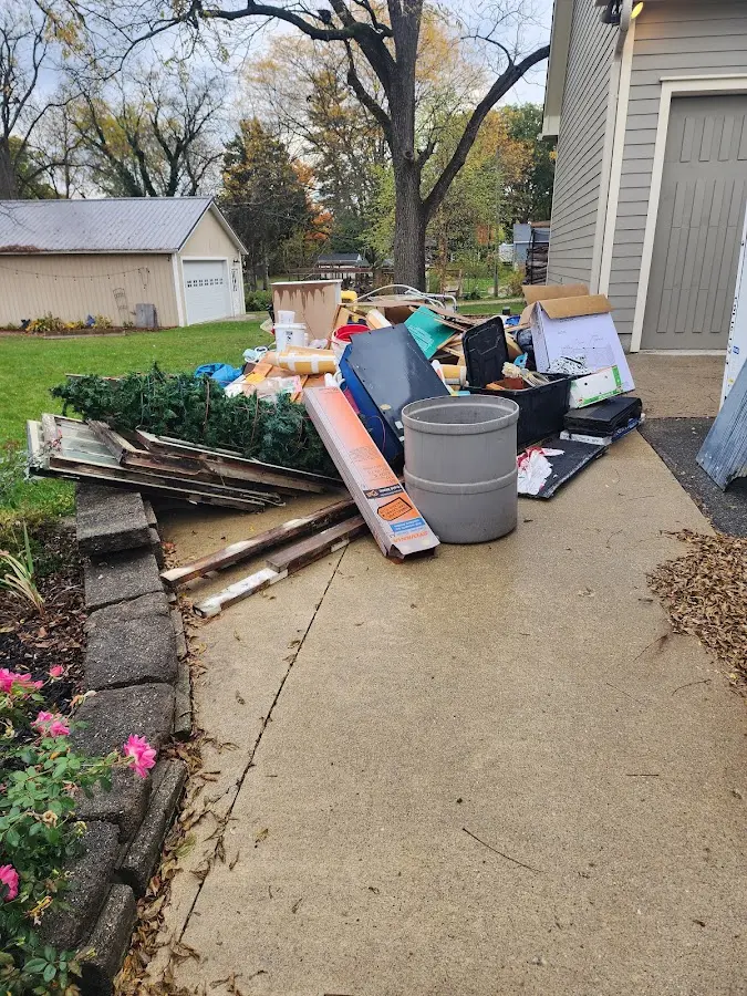 Dumpster being loaded with debris for Estate Cleanout Dumpster Rental in Val Verde Park